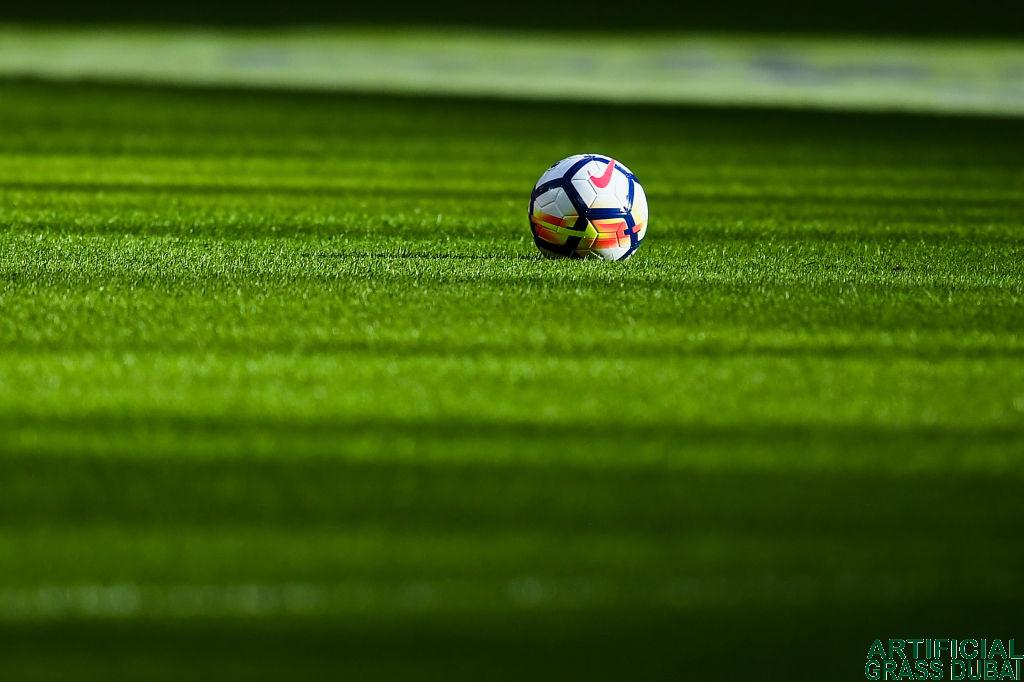 Why is football artificial grass considered best for football players?